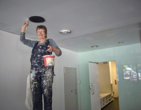 Volunteers Paint Ceiling Of The New Habitat Hub Room.