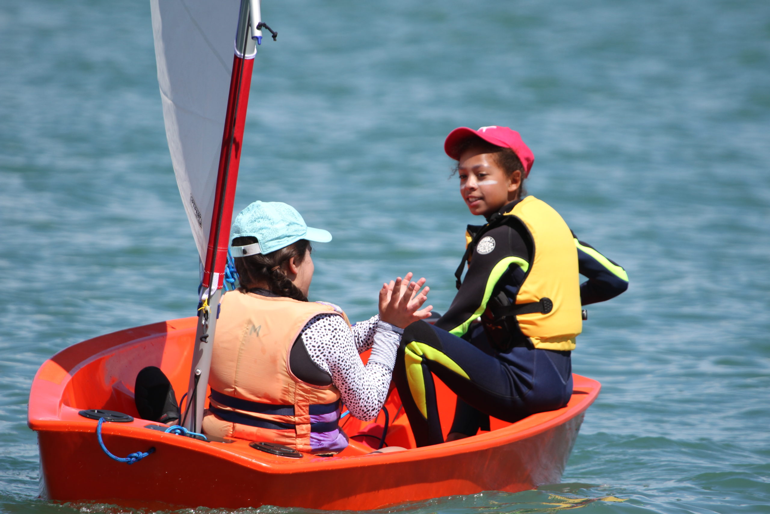 learning to sail in a plastic optimist