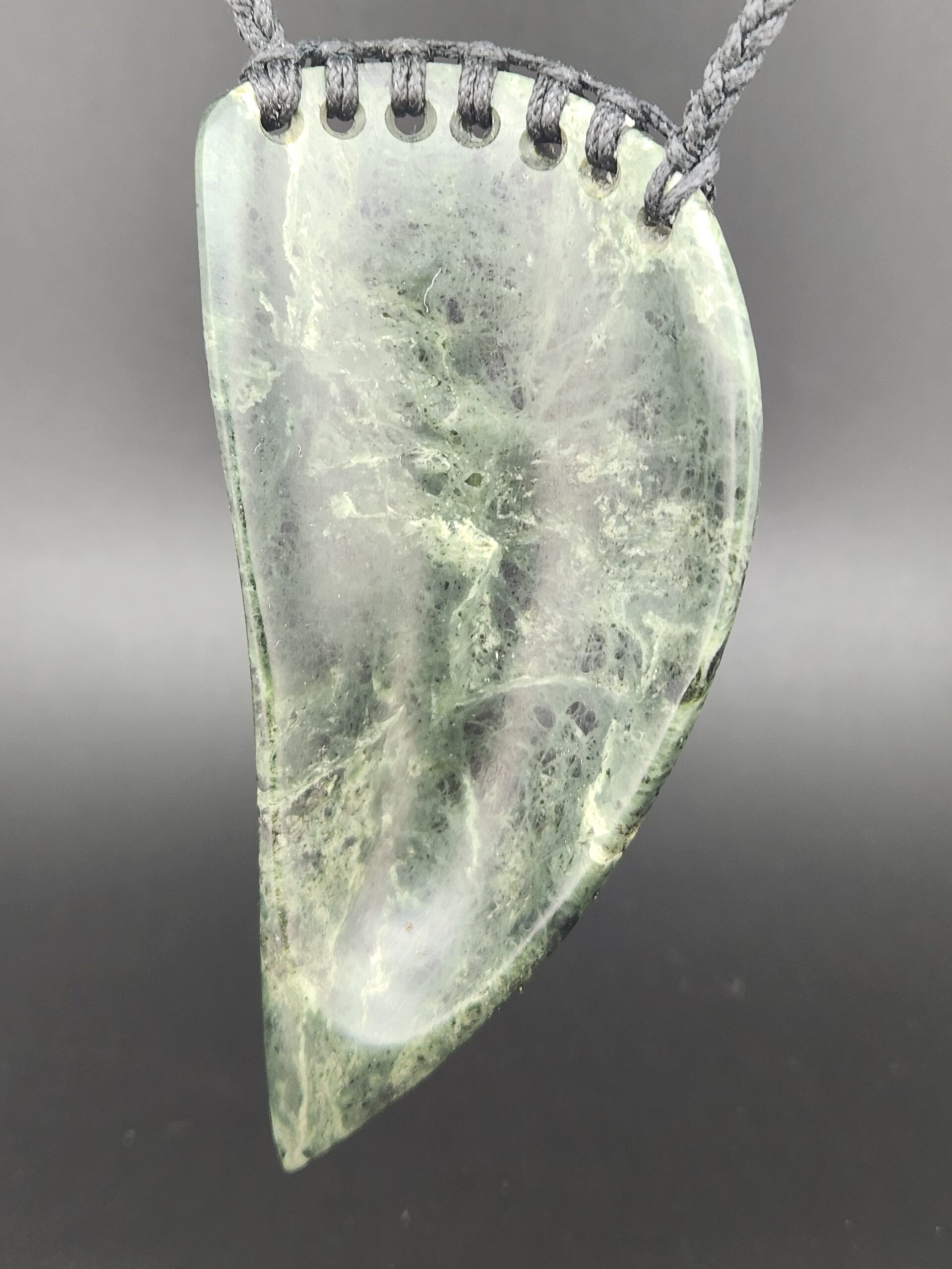 back of greenstone pendant
