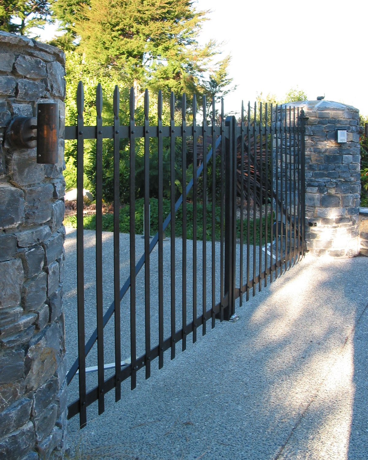 Riveted wrought iron driveway gates