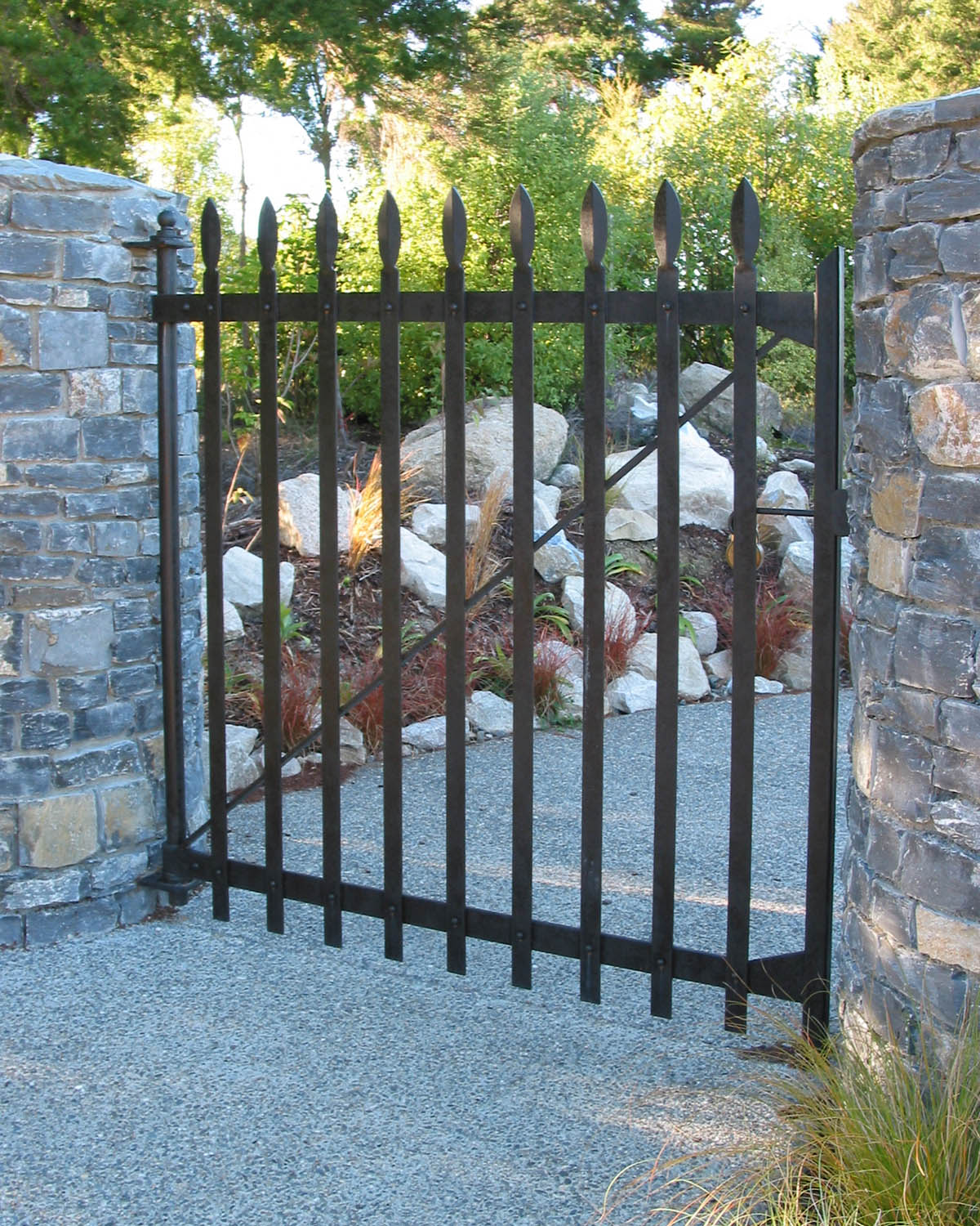 Riveted wrought iron driveway side gate