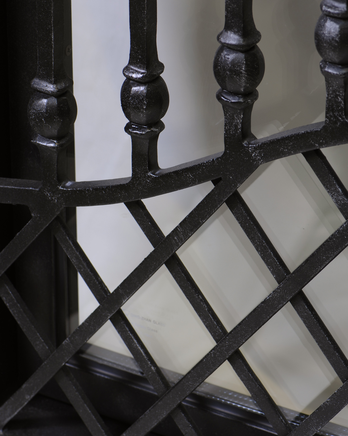 Sienna Iron Doors: interlacing steel & bushed balusters